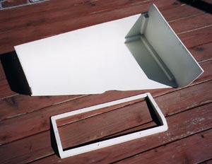 Wood parts which form "tray" and "riser".